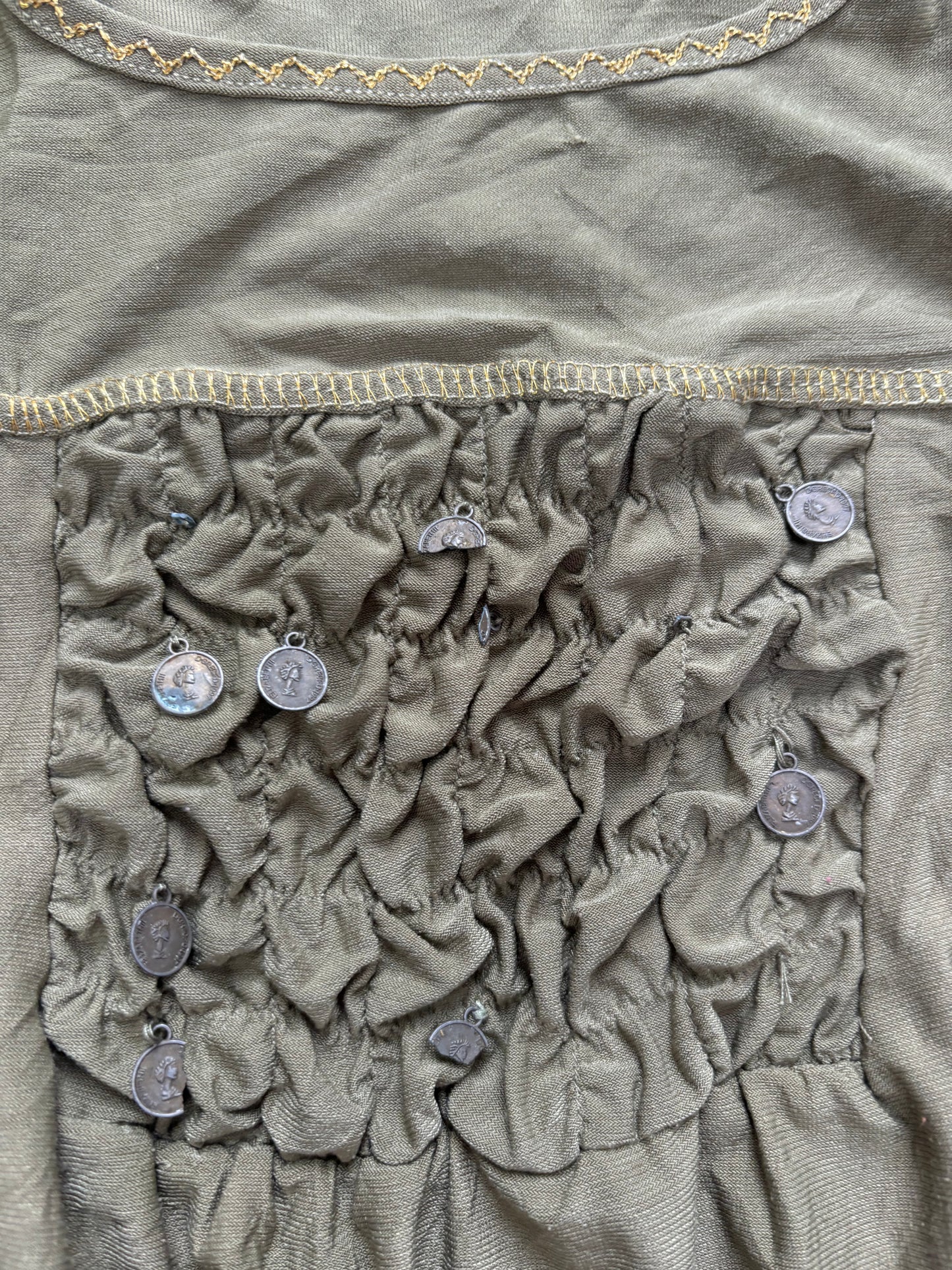 green long sleeve top with coin details
