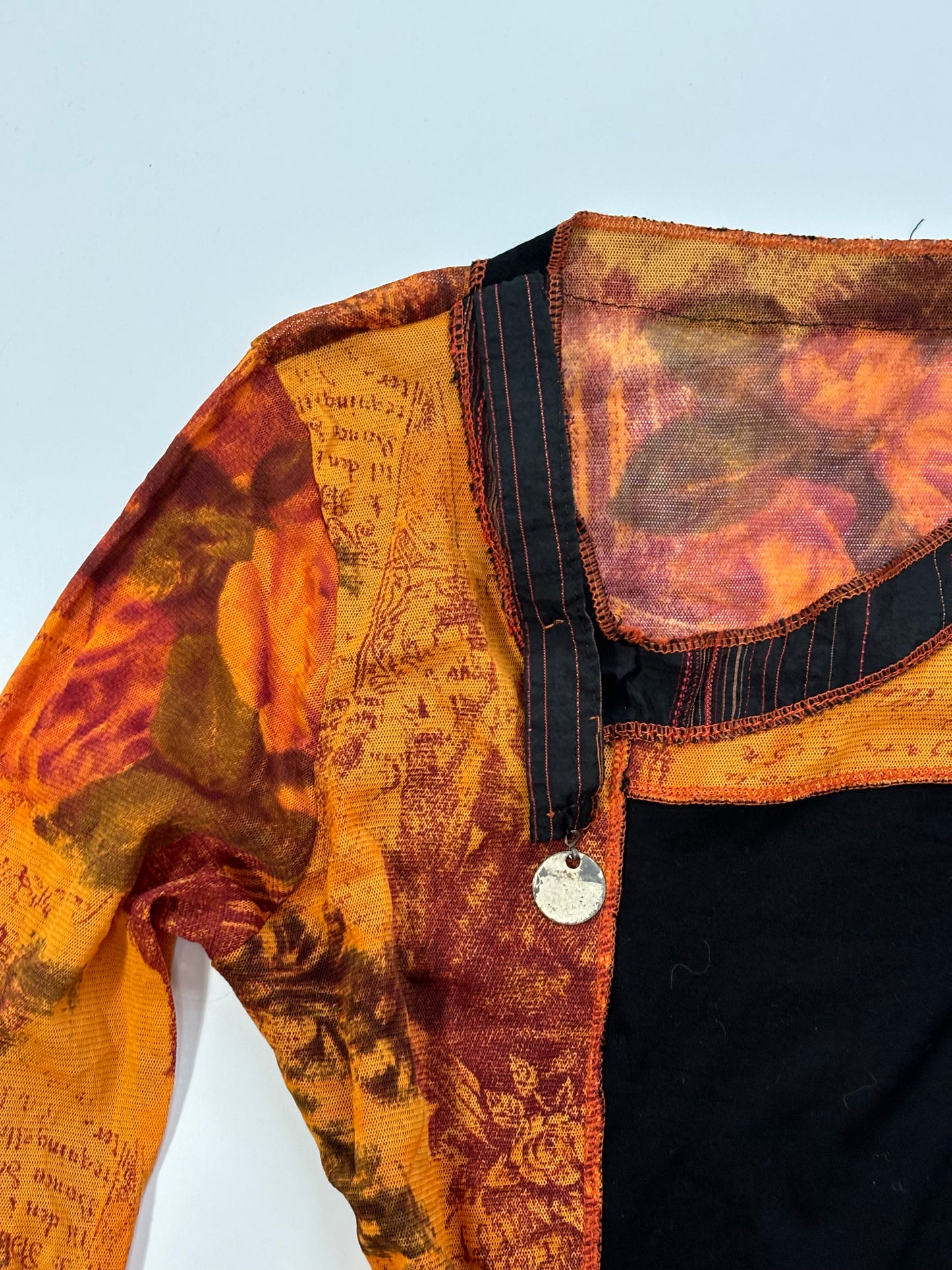 orange long sleeve asymmetrical top
