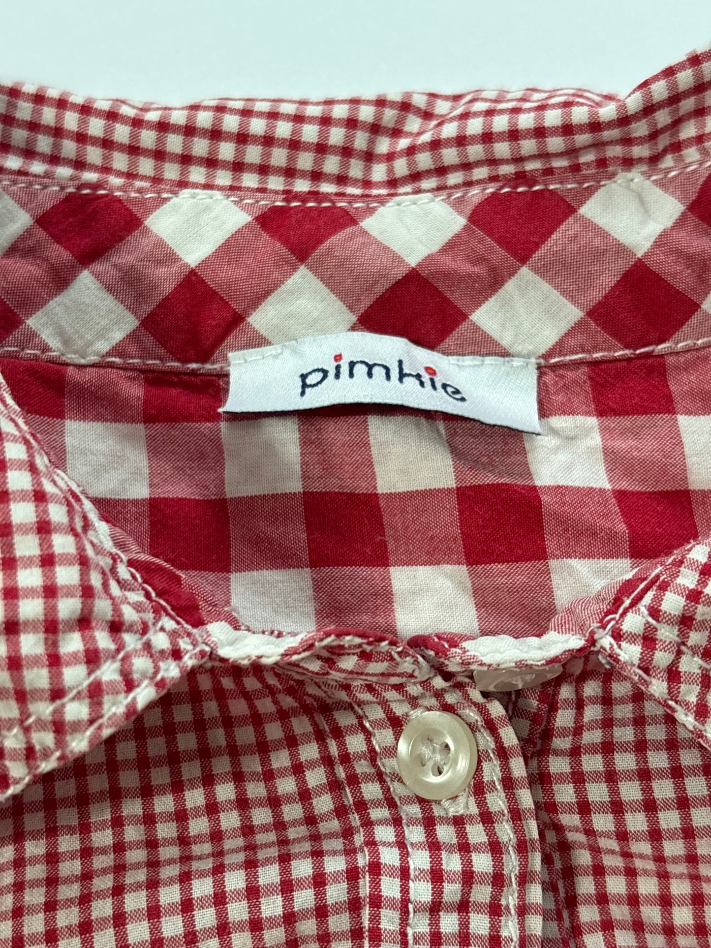 red and white blouse shirt