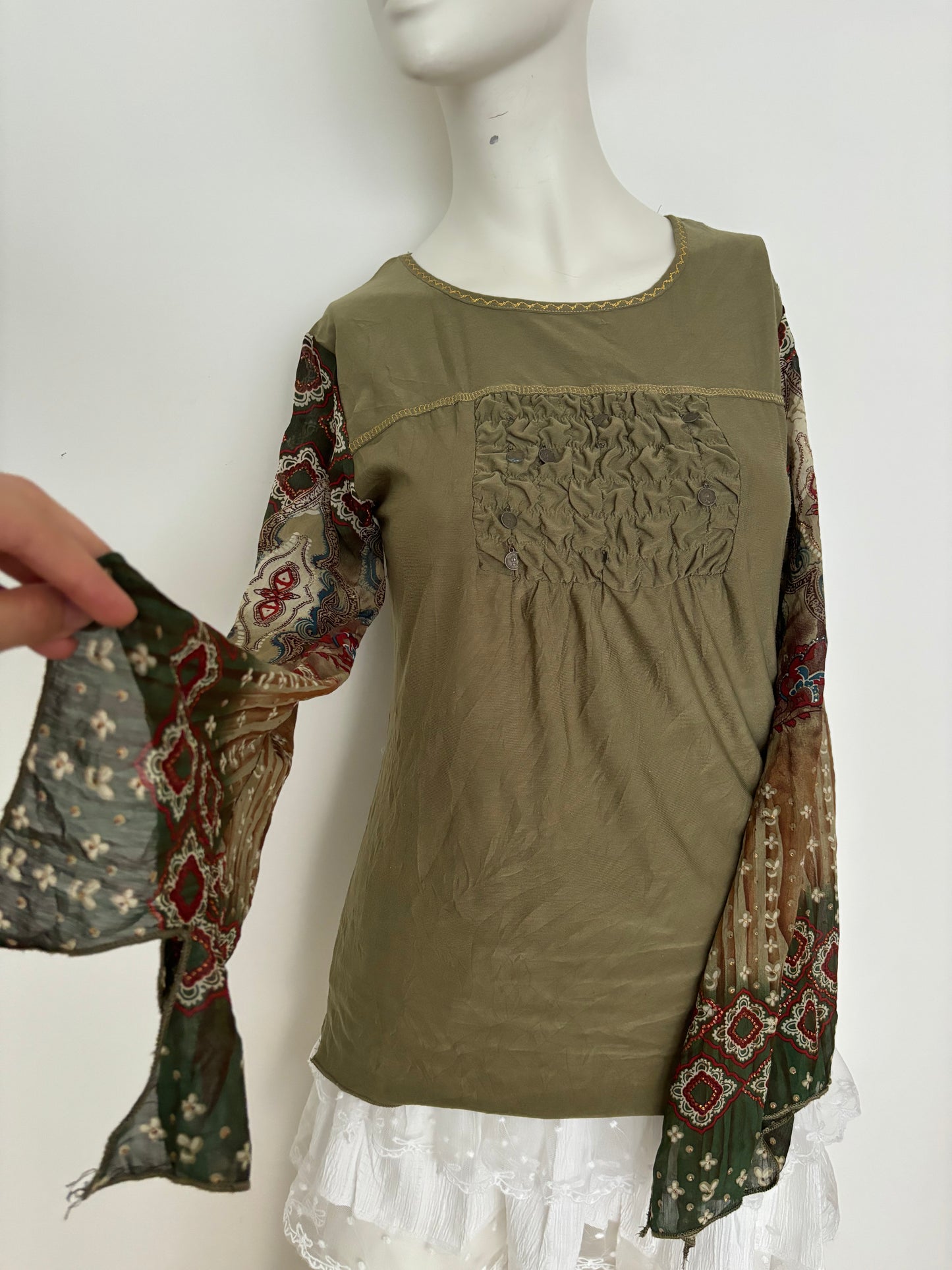 green long sleeve top with coin details